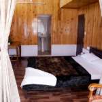 Double bedded wooden room of Darjeeling Villa